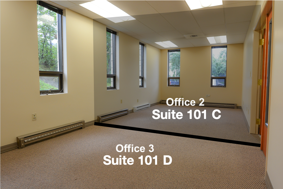 Interior of RSD Properties' Suites C&D at the 750 W 2nd Avenue commercial office building in Anchorage, Alaska. Tan walls and carpet, windows all around. A gray graphic denotes border between suites, and text at the bottom is "Office 3 Suite 101 D," with top text "Office 2 Suite 101 C"