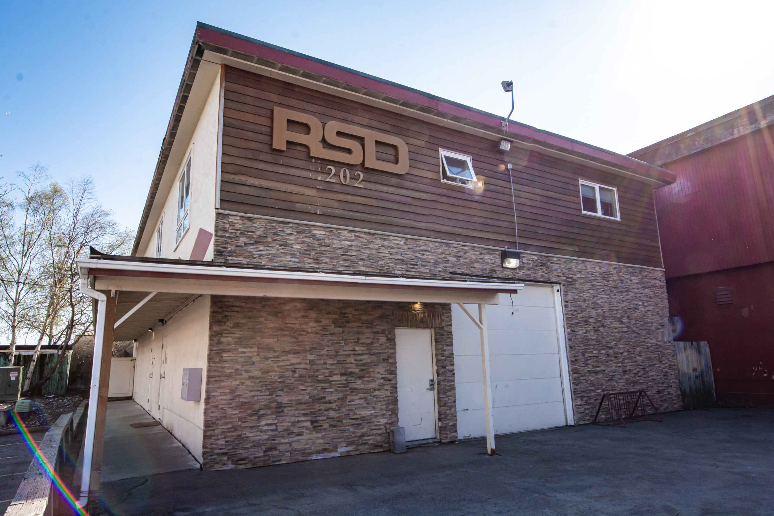 Exterior of RSD Properties' 202 E 26th Ave commercial office building on a sunny Anchorage, Alaska day